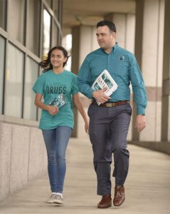 Darren Tessitore and daughter walking to a drug education class