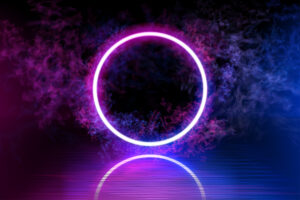 Neon color geometric circle on a dark background. Round mystical portal, luminous line, neon sign. Reflection of blue and pink neon light on the floor. Rays of light in the dark, smoke. Vector.